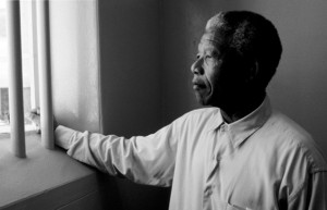 Mandela gazing through bars at former prison